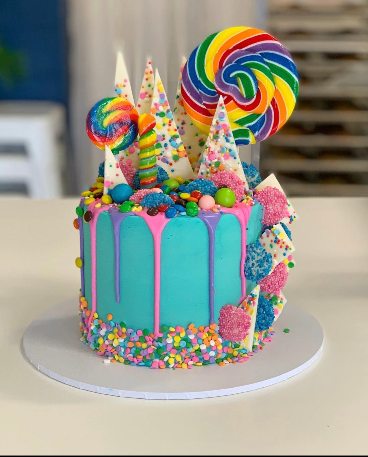 Premium Photo | Rainbow candy birthday cake for kid